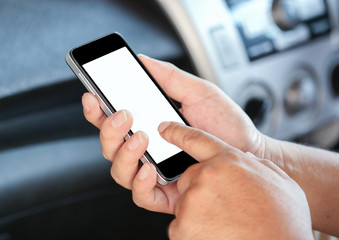Man using smartphone in a car.