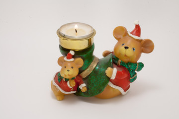 Fototapeta premium ceramic candle holder Christmas bears with burning wax candle isolated on white background 
