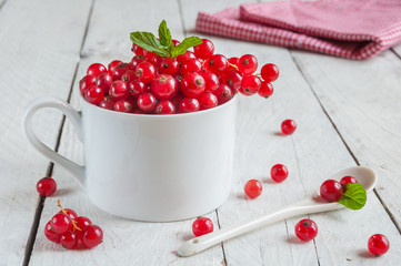 Red currant on wooden table