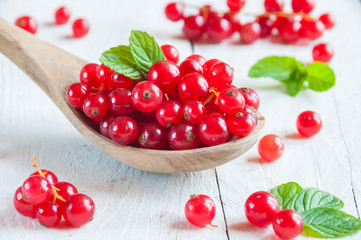 Red currant on wooden table