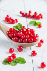 Red currant on wooden table