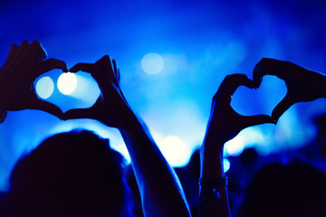 Couple showing heart with hands