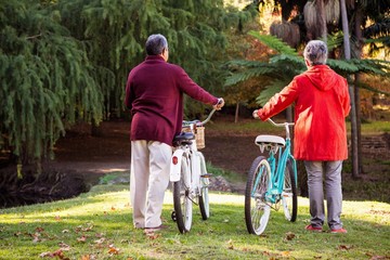 Fototapeta premium Couple with bicycle at park