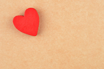 Heart on cardboard background