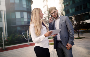 Business colleagues talking outdoors