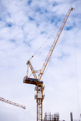Tower crane working in construction site