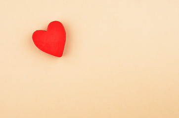 Heart on cardboard background