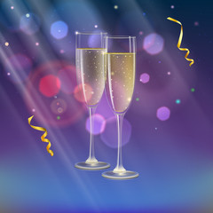 Glasses of champagne and streamer with rays of light on background. Champagne with bubbles in a wineglass with place for your text