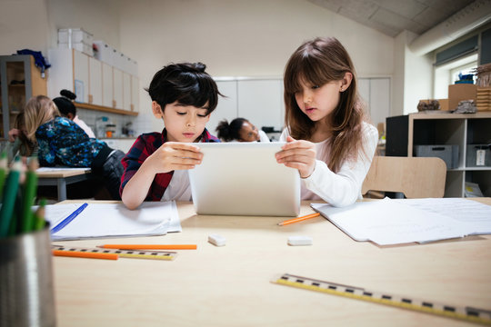 Students using digital tablet in the classroom