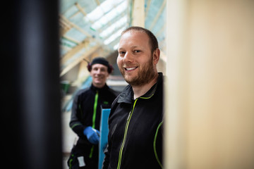 Portrait of coworkers in protective clothing at construction site