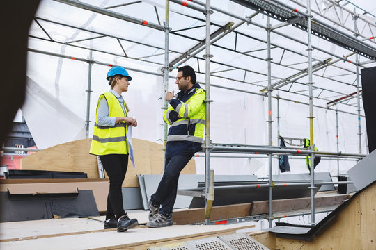 Project managers planning at construction site
