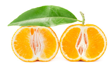 Mandarin with leaf cut in half isolated on a white