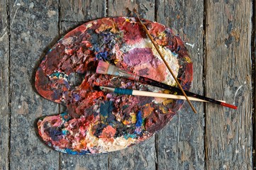Artist paint brushes and palette