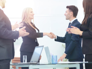 Business partner greeting each other with handshake