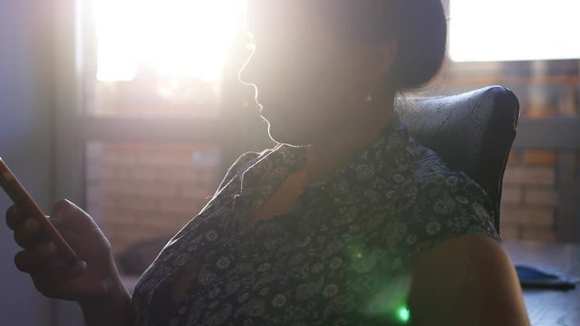 look in the phone under sunset rays