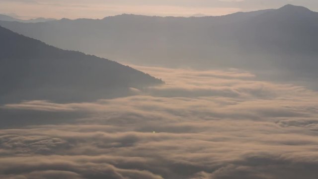 Mountain nature time-lapse of misty clouds fast movement