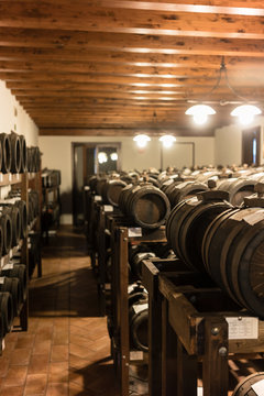 Wooden barrels in storage of Italian balsamic condiment factory