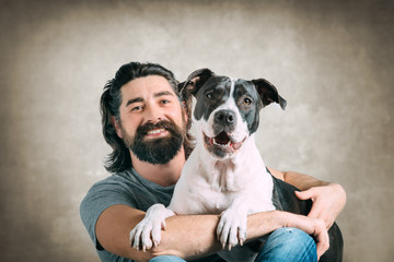 Bearded young man with his dog