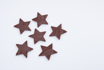 Chocolate or chocolate star on a background.