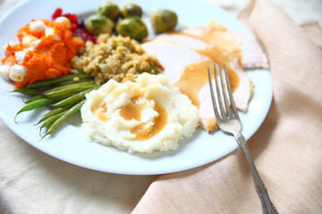 Holiday meal of turkey, stuffing and vegetables 