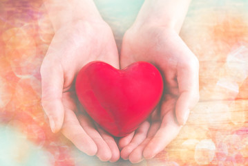 Obraz premium with heart in hands