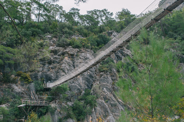 Fototapeta na wymiar Suspension Bridge between Rock