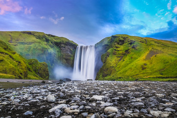 Fototapeta na wymiar Classic view of famous Skogafoss waterfall in twilight, Iceland