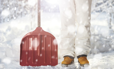 Removing snow with a shovel in the snowfall