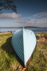 An image of an upturned boat on the shore of Lough Corrib, County Galway, Ireland