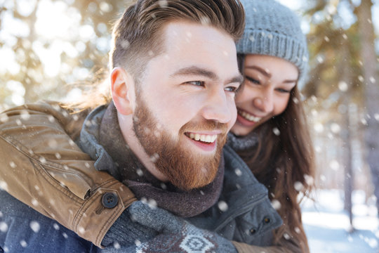 Couple having fun in winter park
