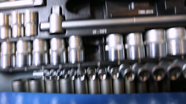 mechanic takes out tool from the box