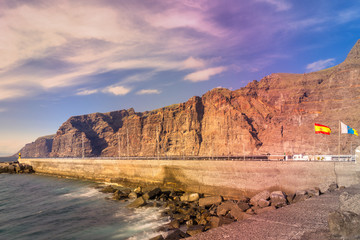 Fototapeta na wymiar Dramatic view of monumental Los Gigantes cliffs on shore of Tenerife, Canary Islands.