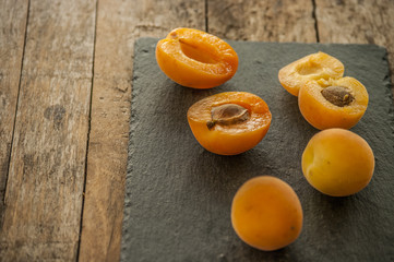 sliced apricots isolated on black background
