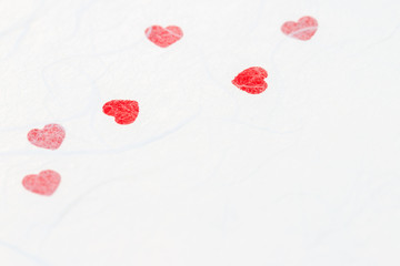 Abstract blurred of red heart on white mulberry paper texture.