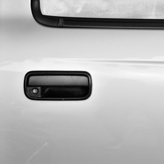 Obraz na płótnie Canvas Outside Old model of black car door handle, right side.