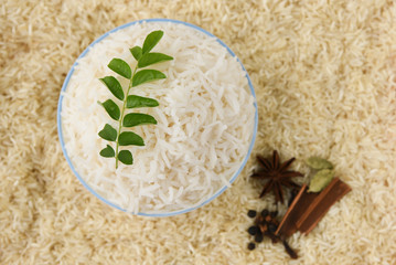 Traditionally Indian raw basmati Rice used to make biryani or pulao , uncooked heart healthy India food with spices 