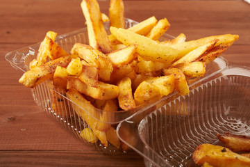 Fried potato chips in plastic packaging