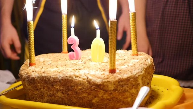 birthday cake with candles spark fireworks in dark room