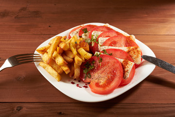 salad with tomato and cheese fries