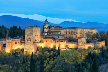 Illuminated Alhambra fortress in Granada - obrazy, fototapety, plakaty