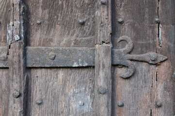 Ancient Wooden Door with Fleur-de-lis Ironwork