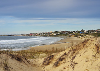 Uruguay, Rocha Department, Punta del Diablo, View over Rivero Beach towards the village.