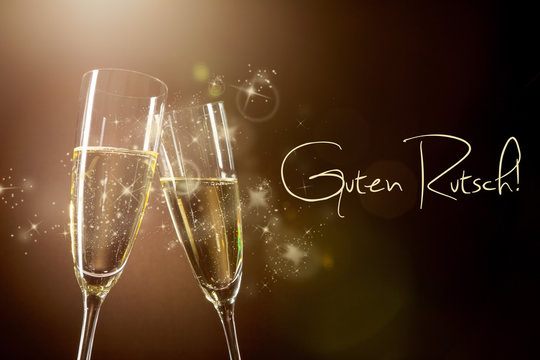 Silvesterstimmung mit Champagnergl&auml;sern und Gl&uuml;ckw&uuml;nschen "Guten Rutsch"