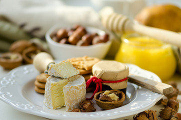 Soft-ripened cheese Piccolo with feijoa jam, honey, hazelnuts, walnuts and wholegrain cookies