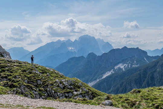 Hiker In Beautiful Mountain Valley Landscape At Summer