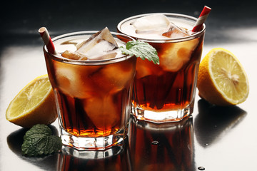 Refreshing soda drink in large glass, cold cola with bubbles 