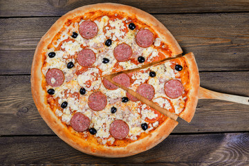 Delicious italian pizza served on wooden table