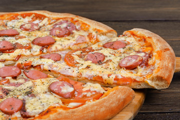 Delicious italian pizza served on wooden table