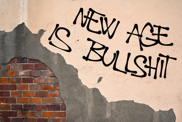 New Age Is Bullshit - handwritten graffiti sprayed on the wall - aversion against modern popular...