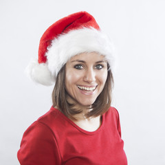 beautiful woman wearing Santa's hat, cheerful face expression